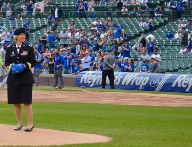 Michelle Letcher throwing a pitch at a cubs game.